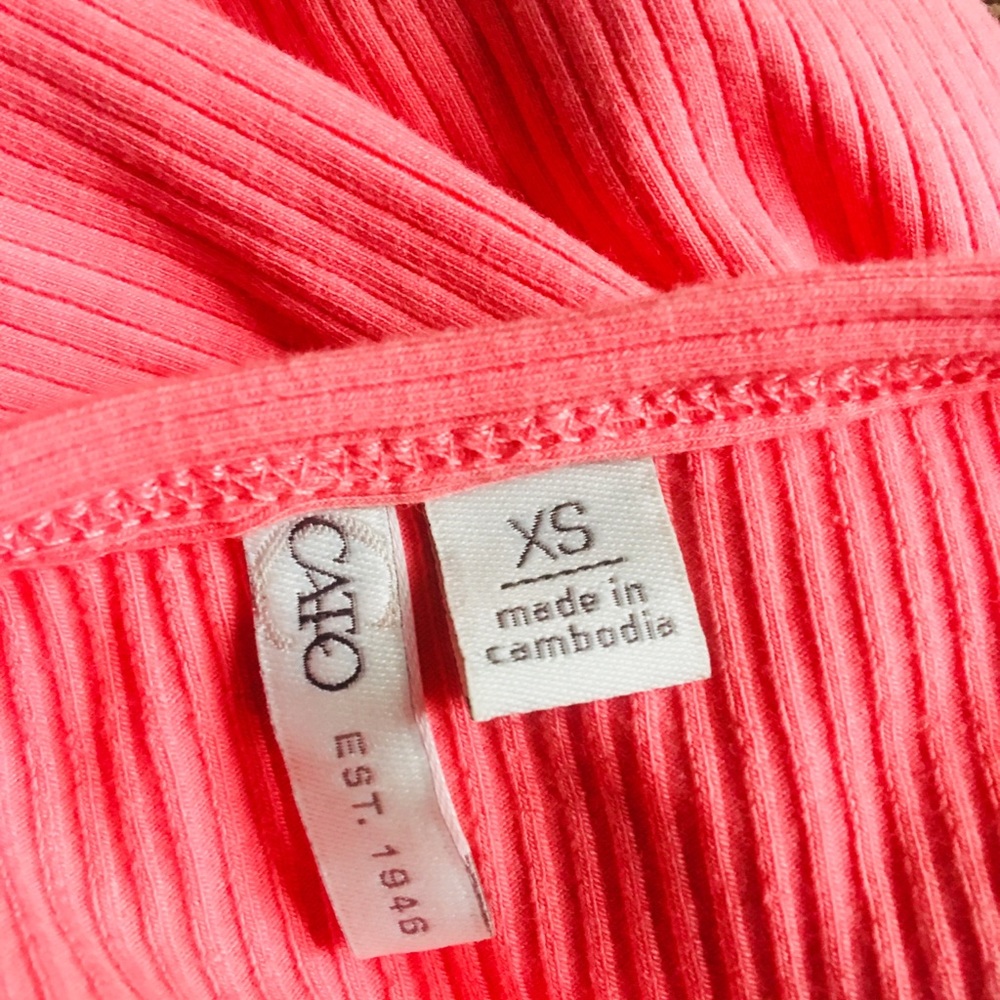 A pink catos shirt